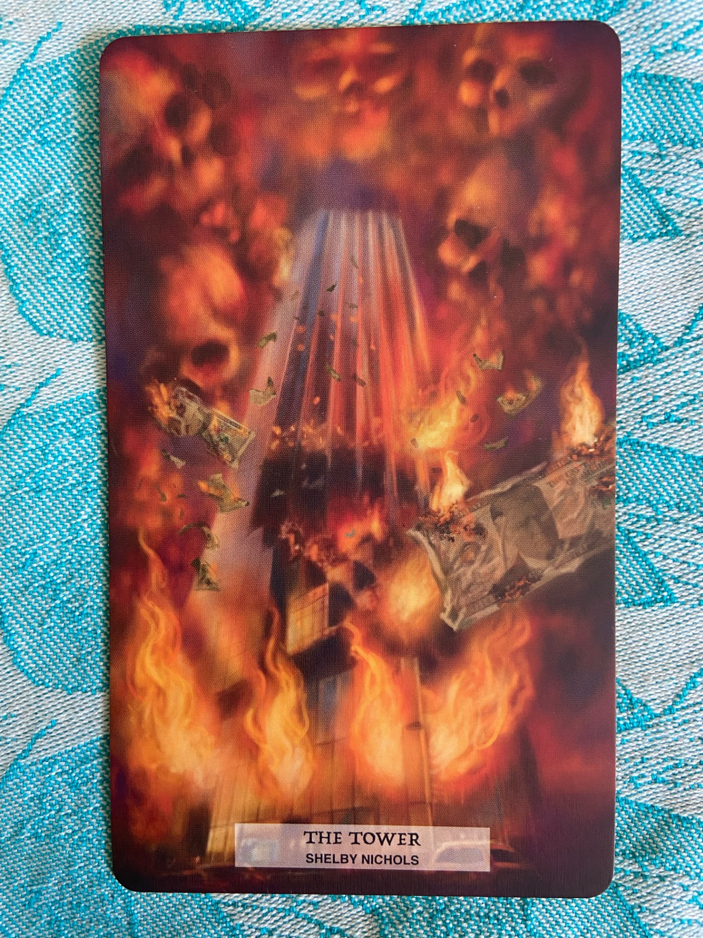 The Tower tarot card depicting a lightning-struck tower with two figures falling